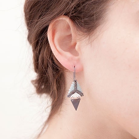 Dual Triangle. Fragment. Mint, grey and white.